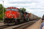 Another westbound rolls past the depot